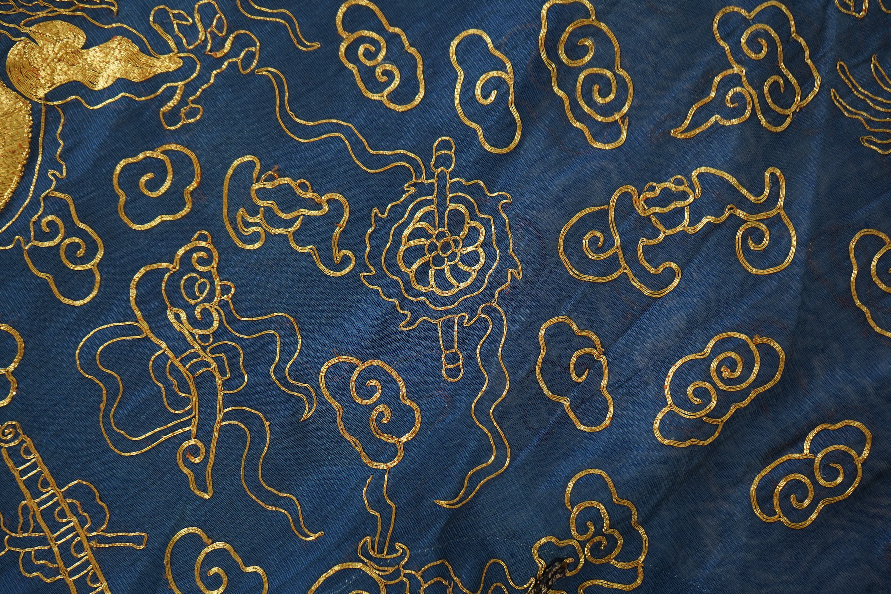 A Chinese gold thread and silk gauze ‘dragon’ summer robe, jifu, early 20th century